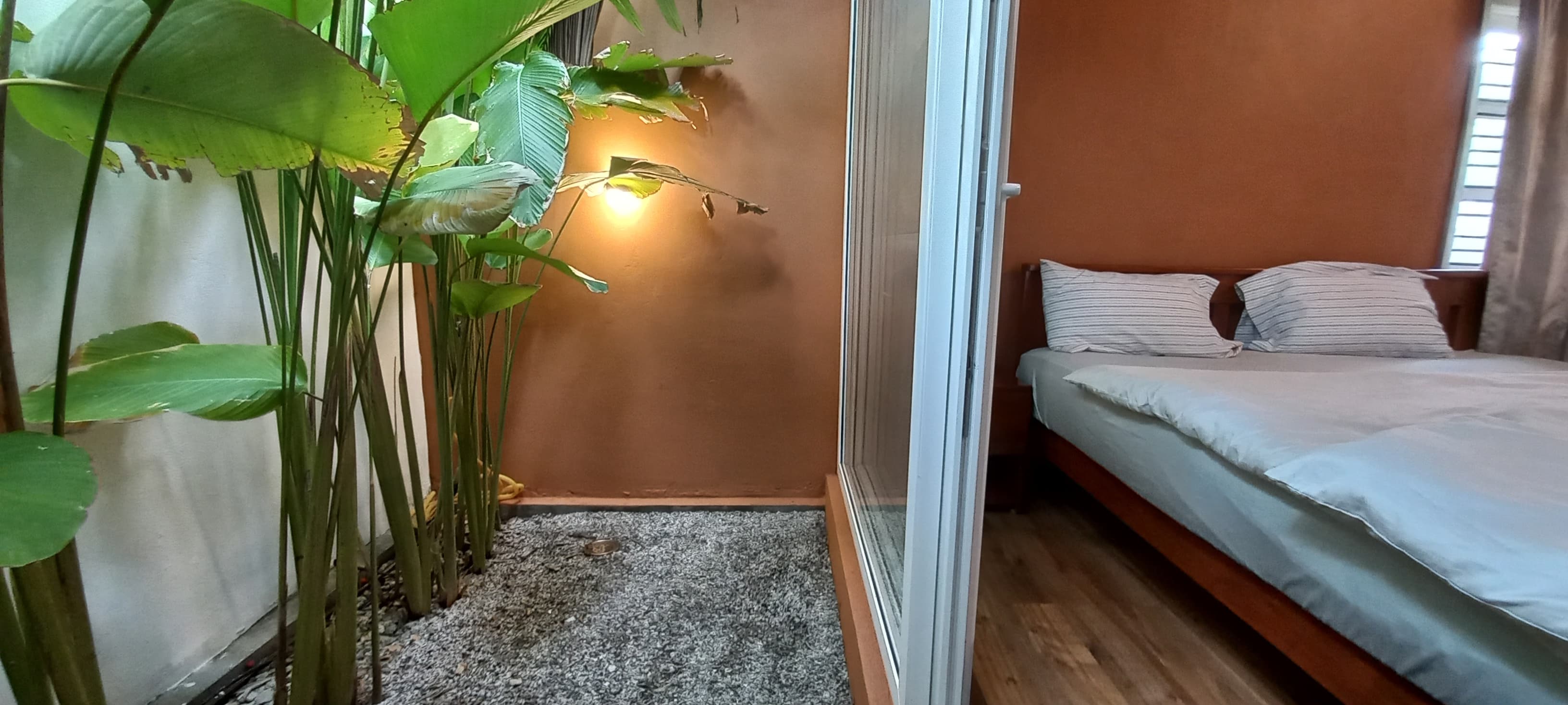 King bedroom with wooden furniture and AC